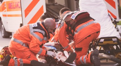 An image showing EMS attending to a patient